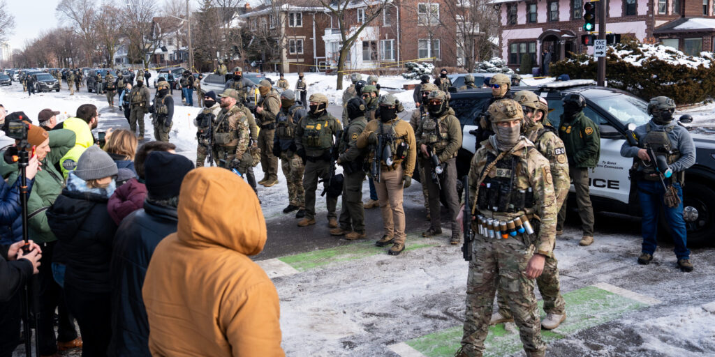 ICE agents at the scene of the shooting. Photo by Chad Davis.